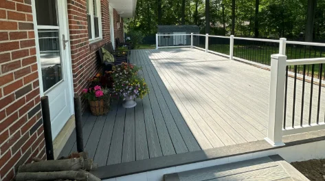 A gray residential synthetic wood deck in Bryn Mawr, PA