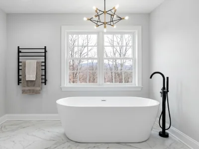 A freestanding tub faucet in a bright, freshly remodeled bathroom in West Chester, PA