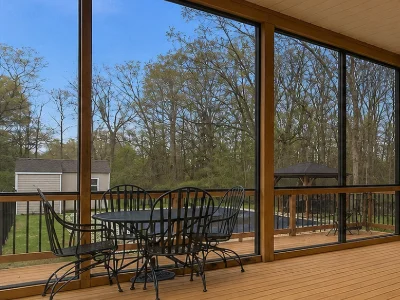 Cedar wood deck with a partial glass pane enclosure in Broomall, PA