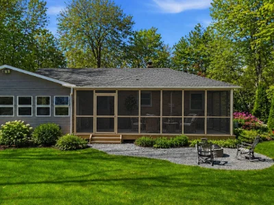 A wooden deck enclosed with screens for outdoor enjoyment in Frazer, PA