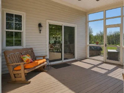 A beautiful enclosed deck that opens to the unenclosed portion of the deck in Frazer, PA