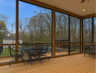 a cedar wood deck enclosed with glass panels in Gladwyne, PA