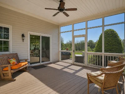 A cozy composite deck with a screen enclosure in a residential home in Paoli, PA