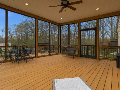 An enclosed screen deck with a roof and cedar decking in Villanova, PA