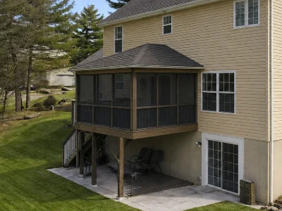A wooden deck enclosed with a roof and screens in Wayne, PA